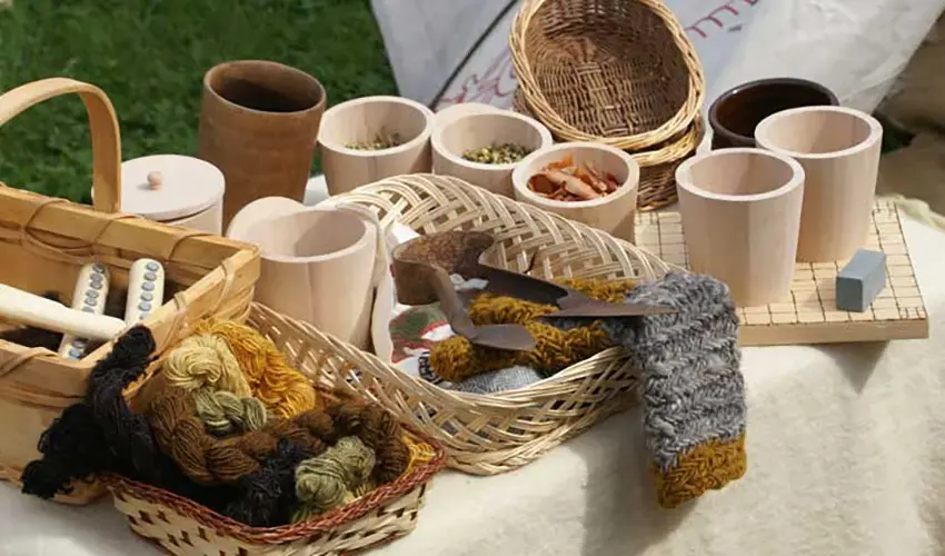 A table top filled with various containers that have wares from the 11th century