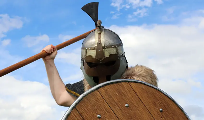 Dave in Macbeths helmet weilding a battleaxe