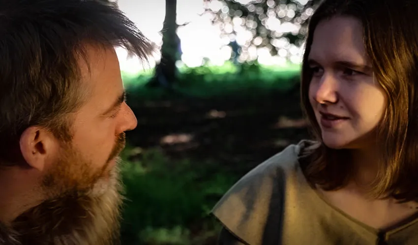 A scene from the documentary where Macbeth and Gruoch are talking to one another in a forest