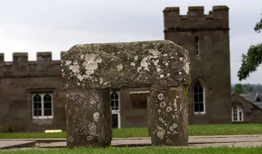The Stone of Scone sits in the foreground with Scone Palace in the background