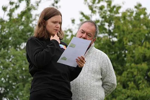 Sara and Paul contemplate the filming notes